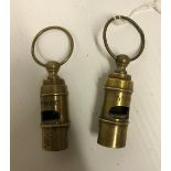 Two modern reproduction brass whistles inscribed "Titanic", 6.