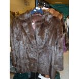 A brown mink jacket with satin lining,