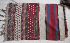 A Belouch tribal rug with repeating foli