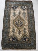 A Caucasian rug with centre medallion on