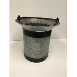 A small bucket with swing handle and bev