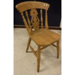 A set of five 20th Century stained beech kitchen chairs in the Victorian manner with fretwork