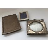Two silver photo frames and a plated photo frame, the plain rectangular frame, 19.