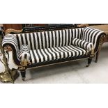 A Victorian ebonised and gilt decorated scroll arm sofa in the Empire taste,