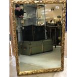 A pair of gilt wall mirrors with foliate decoration, 81 cm x 56 cm,