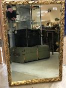 A pair of gilt wall mirrors with foliate decoration, 81 cm x 56 cm,