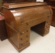 A Victorian oak cyclinder top desk,