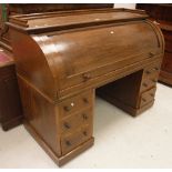 A Victorian oak cyclinder top desk,