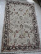 A Ziegler design carpet, the central panel set with foliate design on a cream ground,