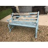 A Victorian cast iron and slatted wooden bench,