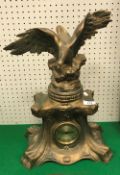 A circa 1900 gold painted spelter mantel clock with spreadeagle surmount (modern movement),