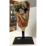 A modern Japanese fabric covered and painted bat depicting a geisha,