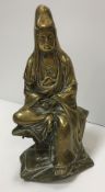 A Chinese bronze figure of Guan Yin seated with scroll in her hands,