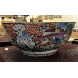 A Qianlong polychrome decorated famille rose bowl with all over decoration of figures in garden