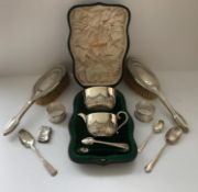 An Edwardian silver sugar bowl and matching milk jug with half reeded decoration,