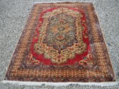 A modern machine woven Persian rug,