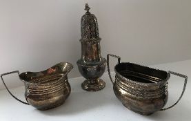 A George V silver sugar caster of typical baluster form (by Goldsmiths & Silversmiths Company