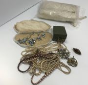 A collection of costume jewellery to include simulated pearl necklaces together with a white rabbit