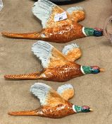 A set of three Beswick flying pheasant ornaments numbered 661/1 and 2 and 3 to back