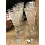 A set of eight hobnail cut glass ale flutes on hobnail cut square bases,