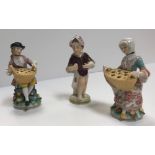 A pair of Höchst miniature figures as lady and gentleman with basket or pot pourri on a floral