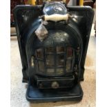 A French enamelled Antra fire or log burner with pierced decoration,