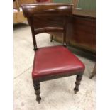 A set of eight Victorian mahogany bar back dining chairs with red wrexine upholstered seats on