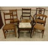 A circa 1900 stained beech rush seat ladder back elbow chair,
