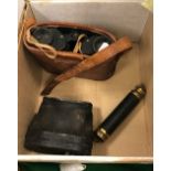 A pair of leather clad binoculars or opera glasses,
