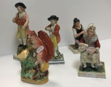 An early 19th Century Pearl ware pottery figure of a hurdygurdy player (circa 1810-20), 23 cm high,