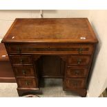 A burr walnut kneehole desk in the early 18th Century manner,