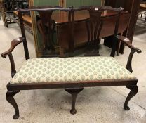 An 18th Century Chippendale style walnut double seat with pierced vase shaped back splats and