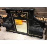 A Victorian cast iron overmantel mirror with central eagle and sunburst relief work panel over a