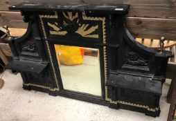 A Victorian cast iron overmantel mirror with central eagle and sunburst relief work panel over a