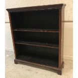An Edwardian mahogany and satinwood strung open bookcase with adjustable shelving,