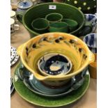 A collection of Continental pottery table wares to include a large green twin-handled serving bowl,