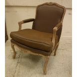A modern "Coach House" limed beech framed armchair with brown silk upholstery in the Louis XV