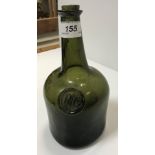 An 18th Century green glass wine bottle with impressed seal to front inscribed "PG", 22.