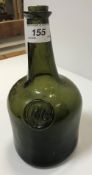 An 18th Century green glass wine bottle with impressed seal to front inscribed "PG", 22.