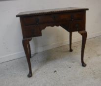 A walnut lowboy in the early 18th Century manner,