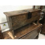 A late 18th/early 19th Century oak six plank hutch with wrought iron lock plate of hasp and staple