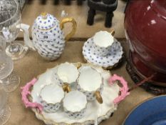 A Coalport blue floral printed and gilt decorated coffee set of writhen form with gold serpentine