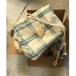 A collection of tartan curtains and a pair of cotton curtains with doll design,