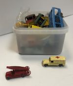 A box containing a collection of Lesney die-cast vehicles including fire engine, Ruston digger,