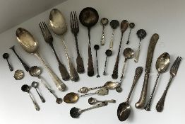 A collection of silver and other cutlery to include tablespoons, sauce ladle, various teaspoons,