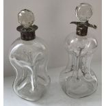 Two blown glass waisted "Glug Glug" decanters with silver rims and glass stoppers