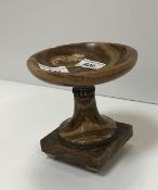 A brown onyx urn with silvered metal embellishments/banding on tapered feet, 14 cm high,