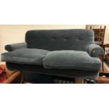 A modern blue velvet upholstered "Loaf" sofa on ebonised bracket feet approx.
