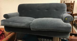 A modern blue velvet upholstered "Loaf" sofa on ebonised bracket feet approx.