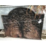 A cast iron fire back inscribed "GR" to front with oak tree,